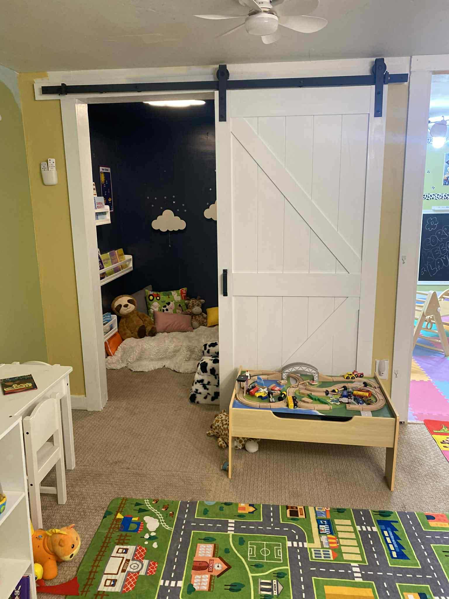 Creative play space with farmhouse barn door